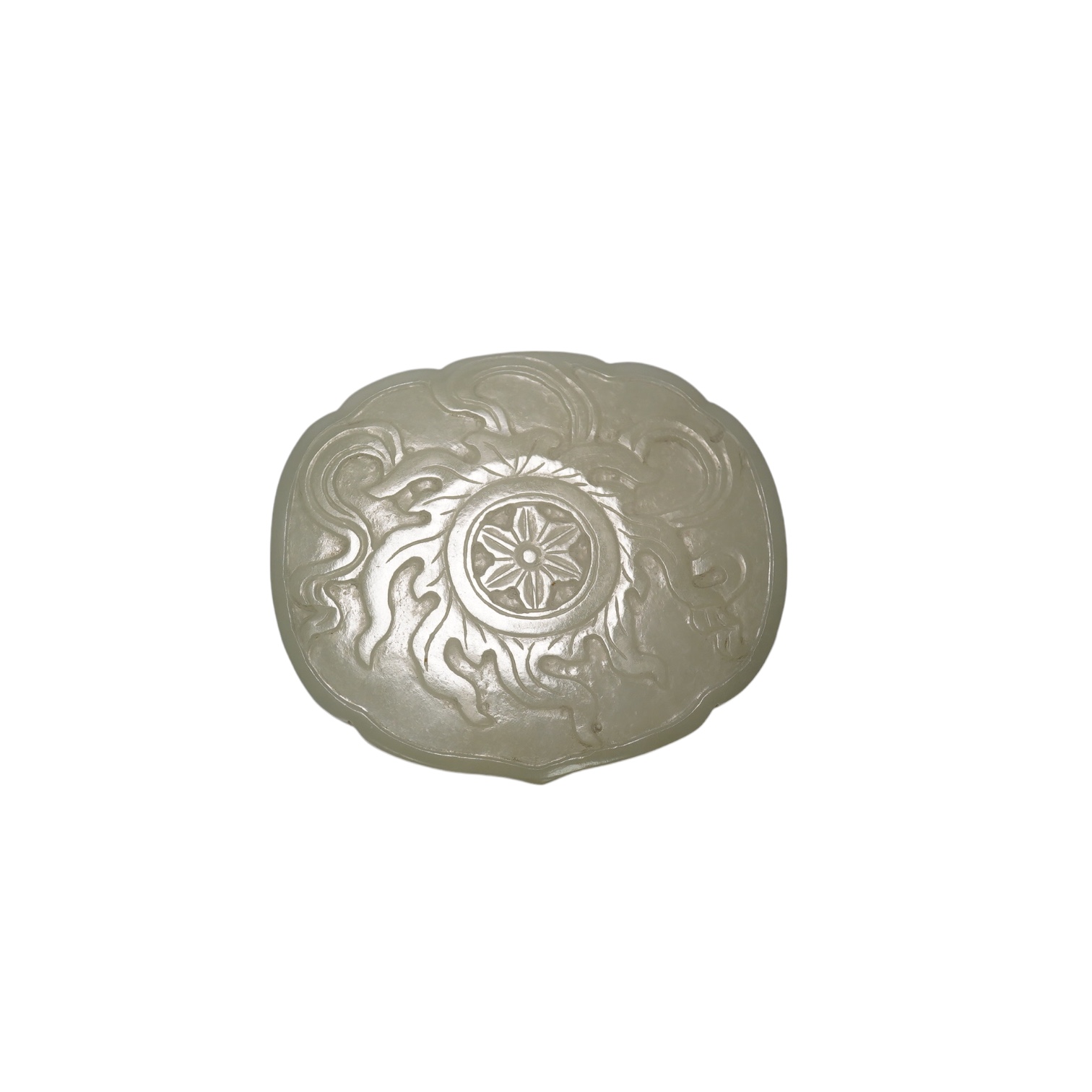 A Chinese pale celadon jade cover for a box, 19th century, carved in relief with a flaming Buddhist wheel emblem, 7.5cm wide. Condition - box base lacking, cover with feint crack